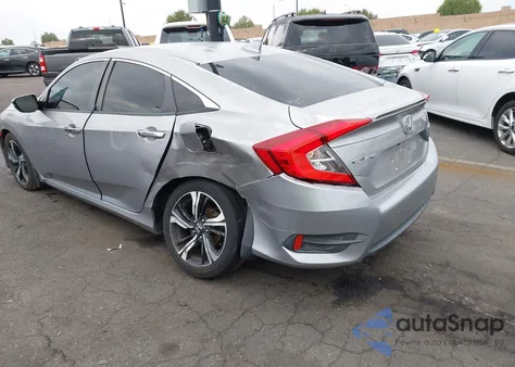 2017 Honda Civic Touring z USA, uszkodzony, nr VIN 2HGFC1F9XHH634745